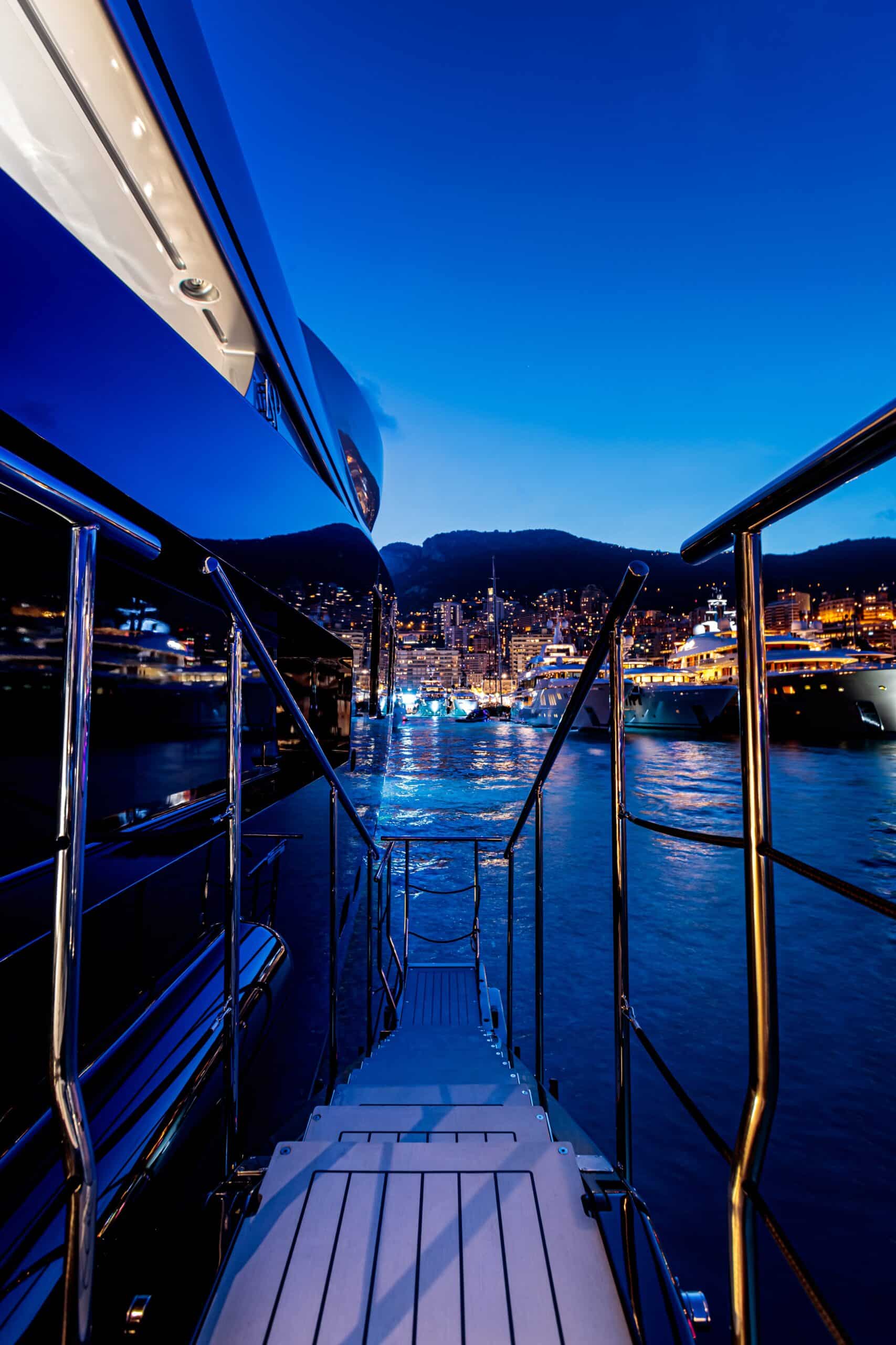 A vertical shot of stairs of a private yacht leading to admiring the beauty of the view